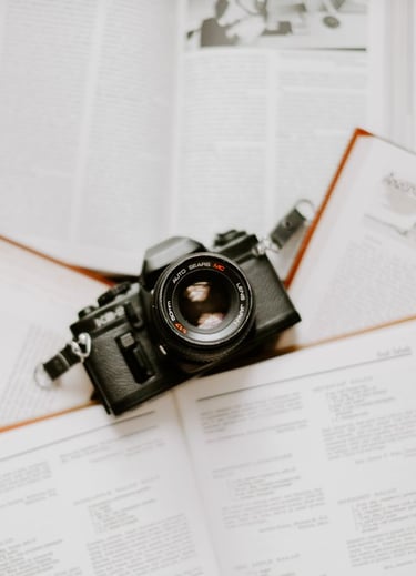 black nikon dslr camera on white printer paper