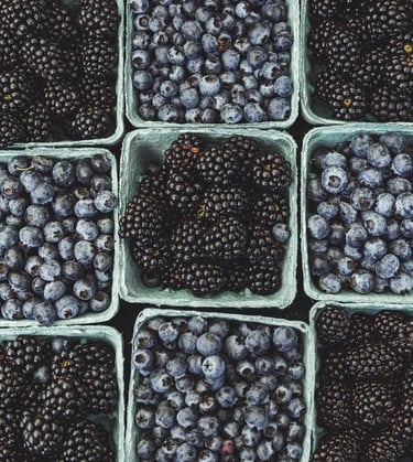 black berries on black surface