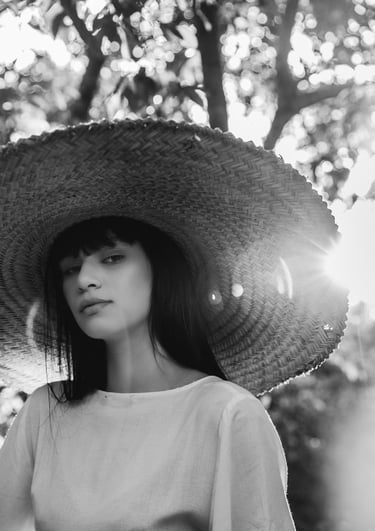 woman in white crew neck shirt wearing brown sun hat