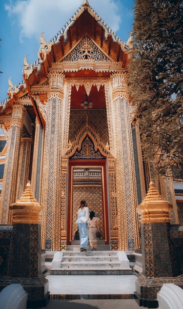 man and woman standing in front of brown concrete building during daytime