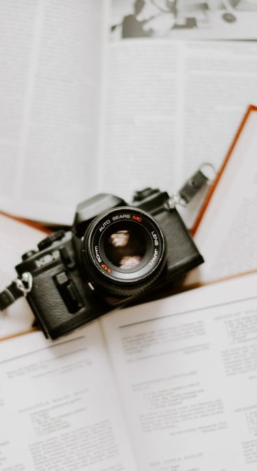 black nikon dslr camera on white printer paper