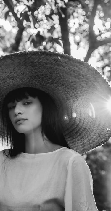 woman in white crew neck shirt wearing brown sun hat