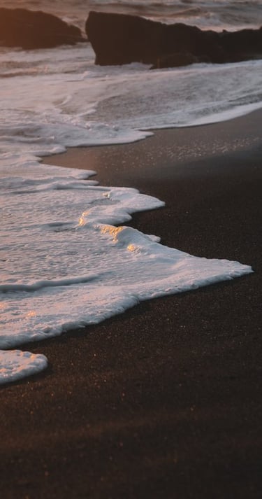 ocean waves crashing on shore during daytime
