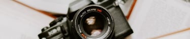 black nikon dslr camera on white printer paper