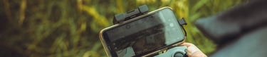 person holding black and gray digital camera