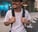 man in white crew neck t-shirt wearing blue cap and black sunglasses