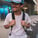 man in white crew neck t-shirt wearing blue cap and black sunglasses