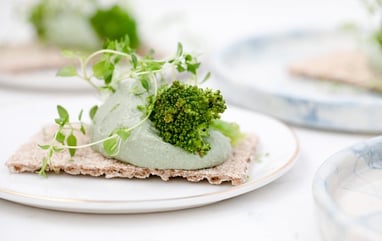 green vegetable on white ceramic plate