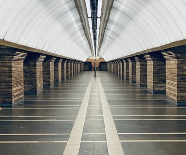 man in black jacket walking on hallway