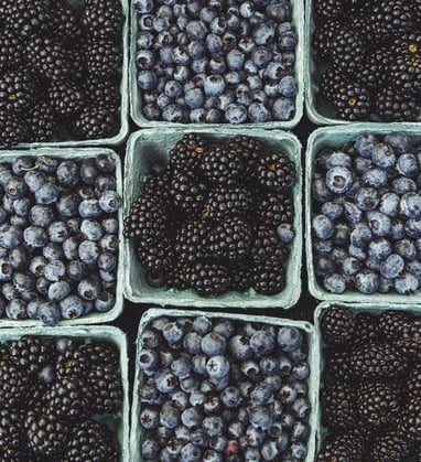 black berries on black surface