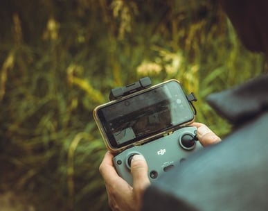 person holding black and gray digital camera