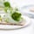 green vegetable on white ceramic plate