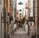 empty hallway between concrete buildings during daytime