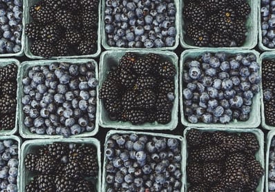 black berries on black surface