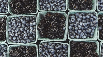 black berries on black surface