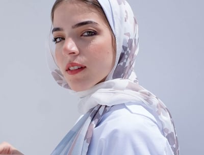 woman in white hijab smiling
