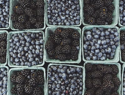 black berries on black surface
