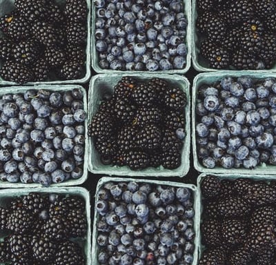 black berries on black surface