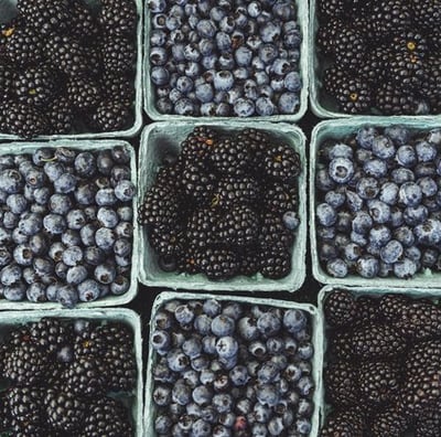 black berries on black surface