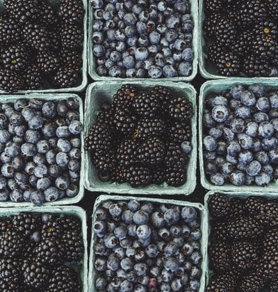 black berries on black surface