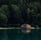 brown wooden house on lake