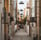 empty hallway between concrete buildings during daytime