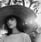 woman in white crew neck shirt wearing brown sun hat