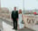 man in black suit standing beside woman in white wedding dress