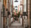 empty hallway between concrete buildings during daytime