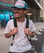 man in white crew neck t-shirt wearing blue cap and black sunglasses