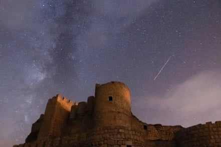 brown concrete building under starry night
