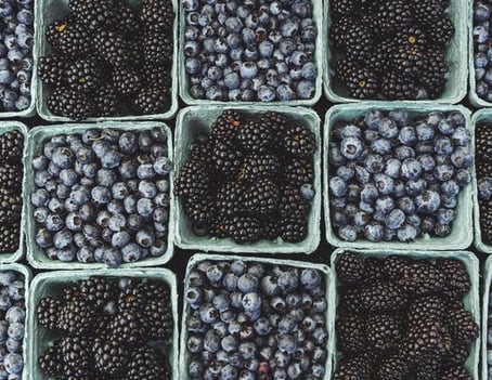 black berries on black surface