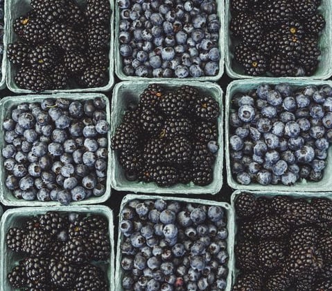 black berries on black surface