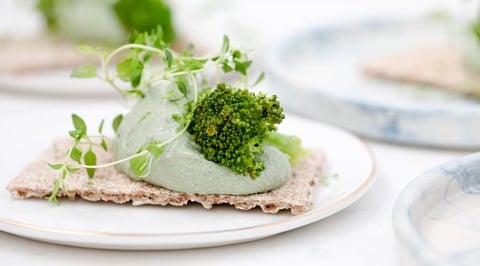 green vegetable on white ceramic plate