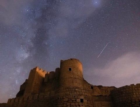 brown concrete building under starry night