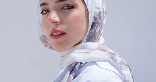 woman in white hijab smiling