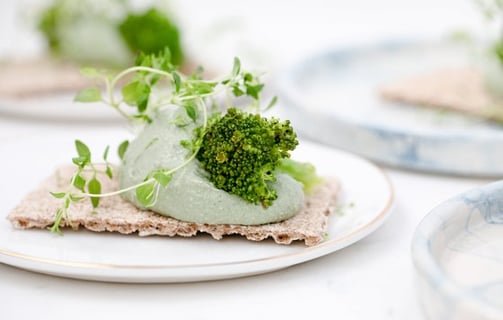 green vegetable on white ceramic plate
