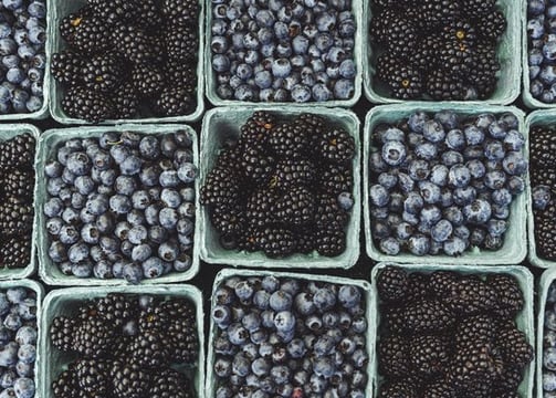 black berries on black surface