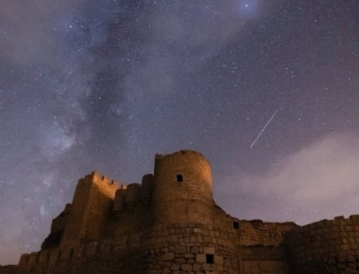 brown concrete building under starry night