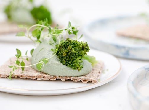 green vegetable on white ceramic plate