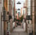 empty hallway between concrete buildings during daytime
