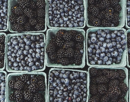 black berries on black surface