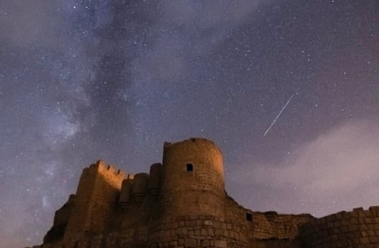 brown concrete building under starry night
