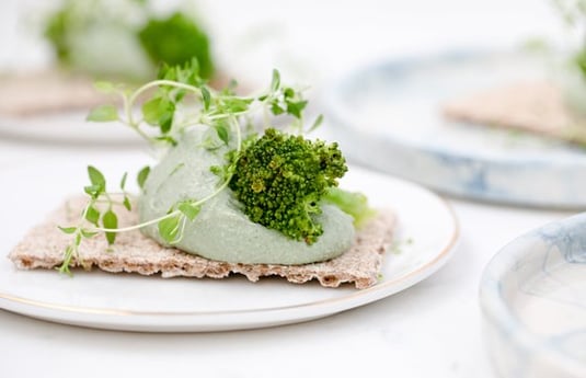 green vegetable on white ceramic plate