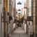 empty hallway between concrete buildings during daytime