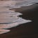 ocean waves crashing on shore during daytime