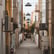 empty hallway between concrete buildings during daytime