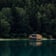 brown wooden house on lake