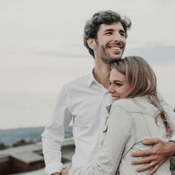 A couple hugging and smiling after a session