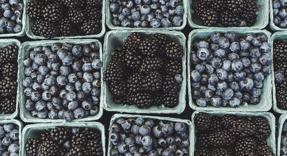 black berries on black surface